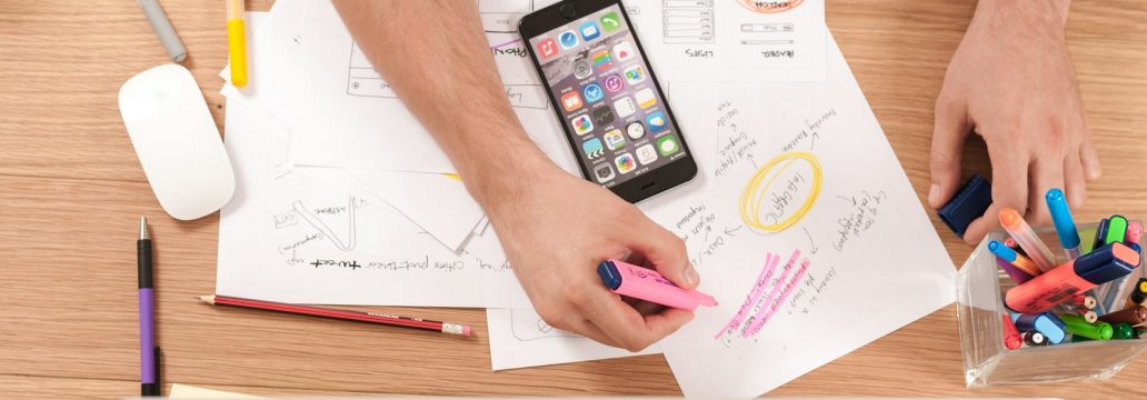 person writing on white paper